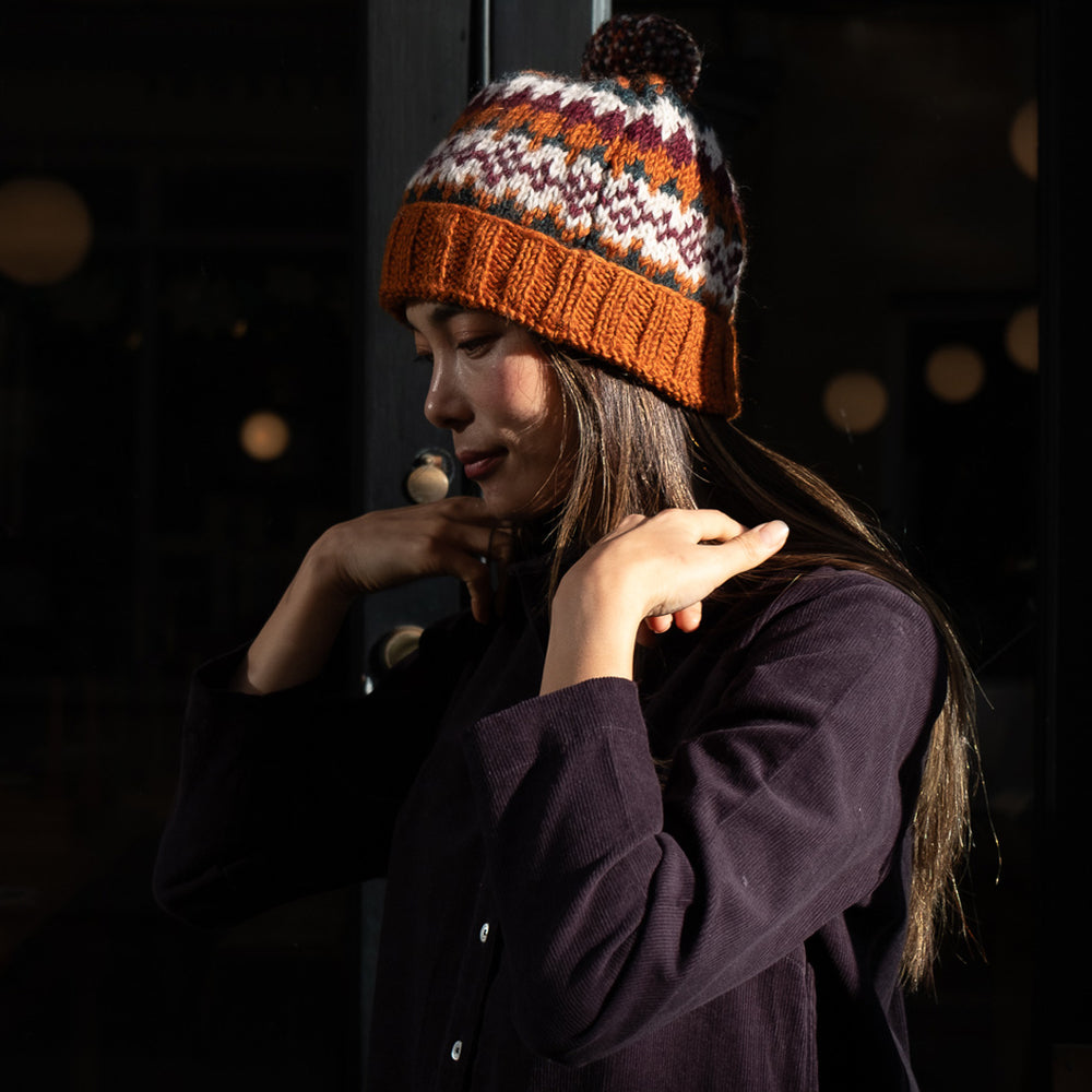 
                      
                        Nora Fair Isle Wool Bobble Hat
                      
                    