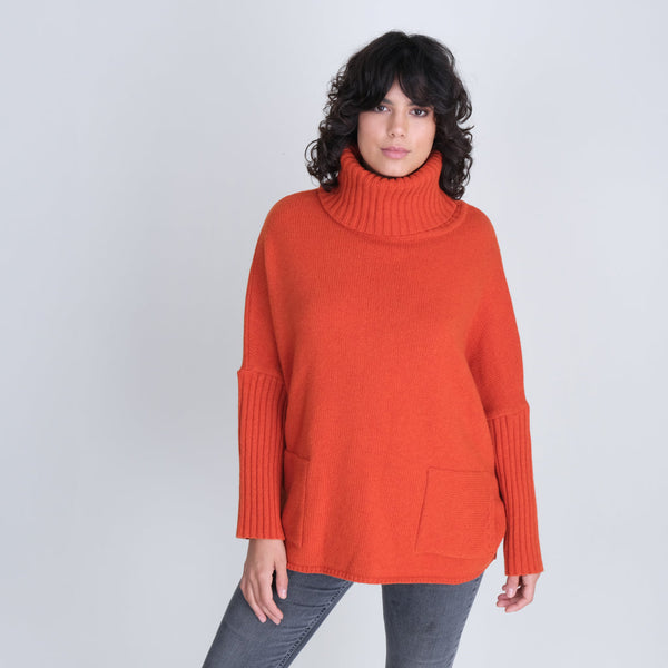 Orange coloured oversized wool jumper with cowl neck